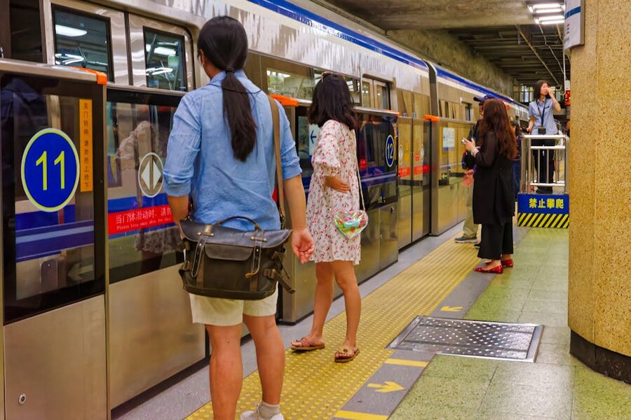 Beijing subway platform with commuters waiting for train