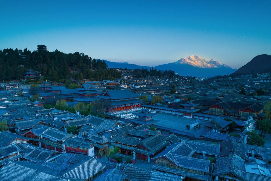 Aerial view of Lijiang Old Town with mountains in the background