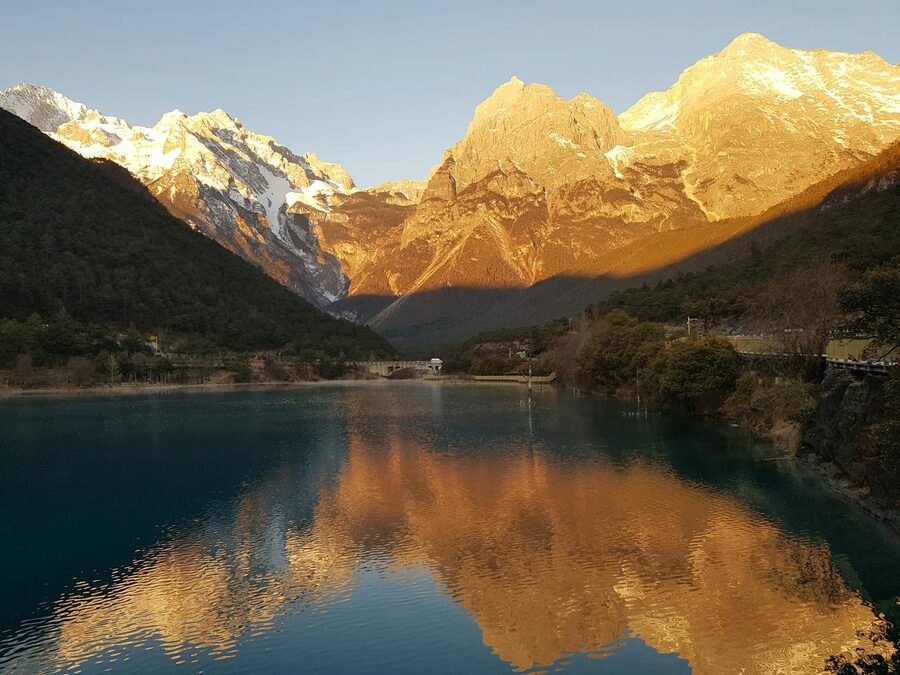 Jade Dragon Snow Mountain reflected in a lake at the base