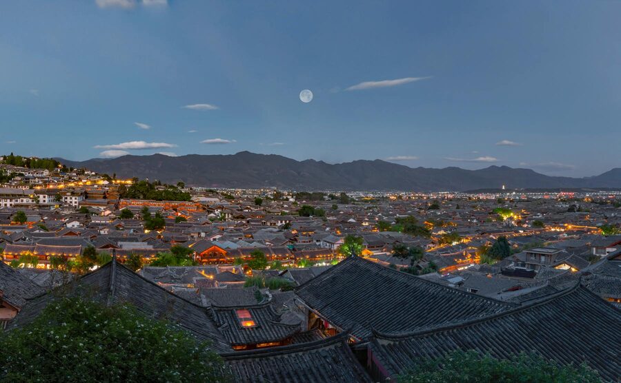 Twilight view of Lijiang Ancient Town with traditional buildings