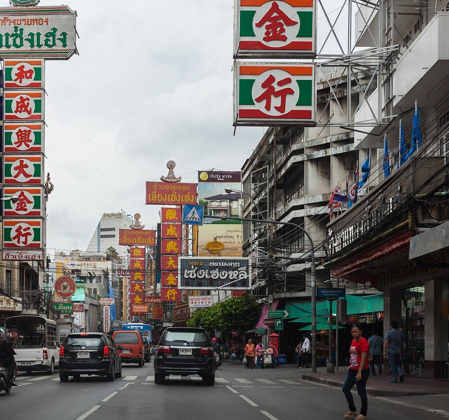 Chinatown Yaowarat Road Bangkok at night with crowds and signs