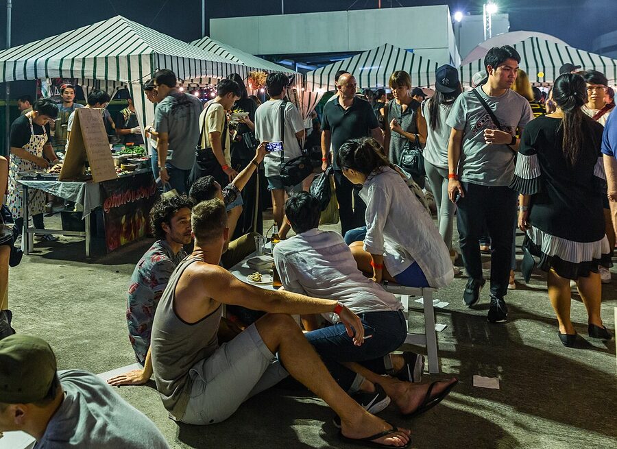 Bangkok night market with stalls and lanterns
