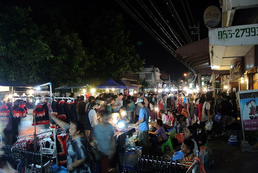 Night market lights and food stalls in Chiang Mai after sunset