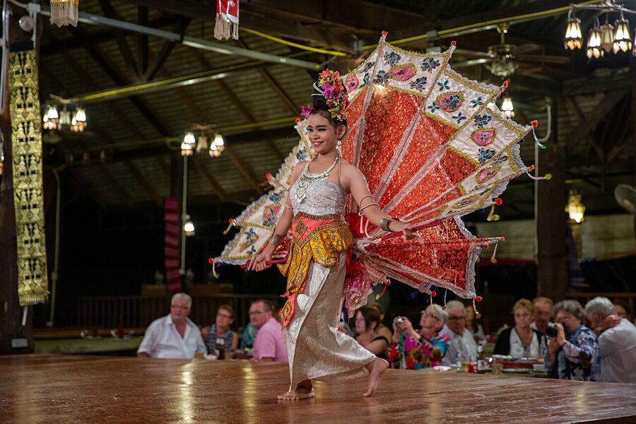 Traditional Lanna dancers performing during a khantoke banquet in Chiang Mai