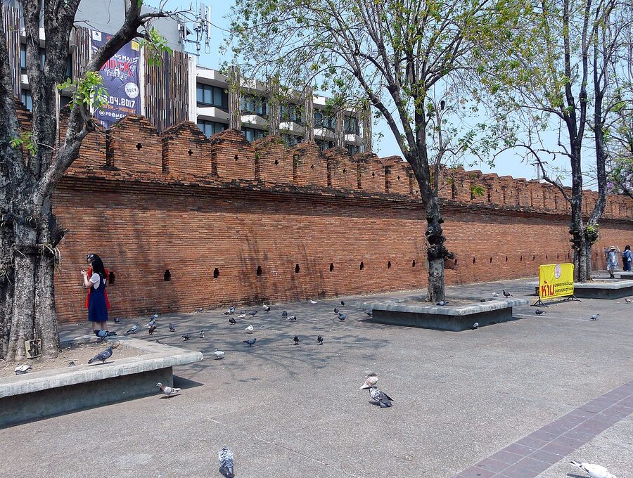 Tha Pae Gate with red-brick remnants of the old city wall in morning light, Chiang Mai