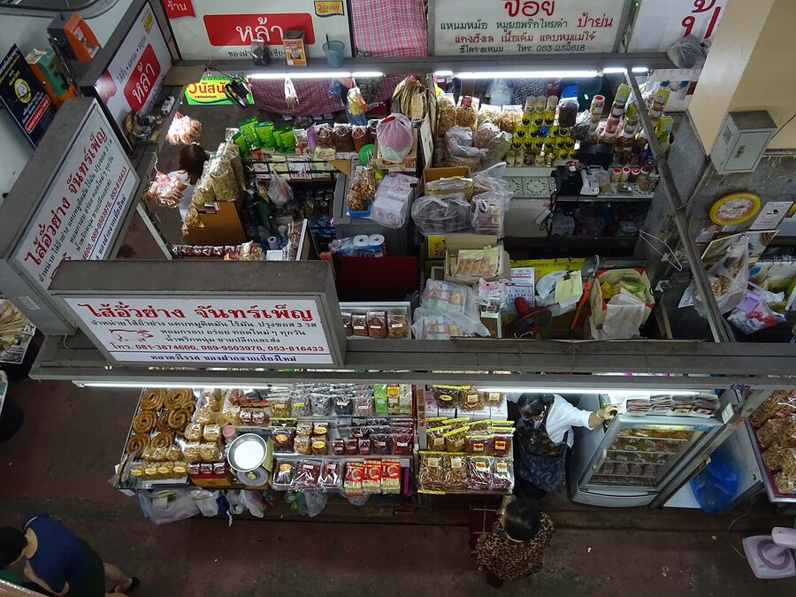 Morning shoppers moving through the interior of Warorot Market in Chiang Mai
