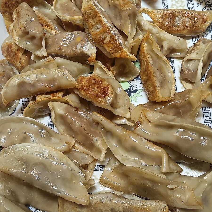 Guotie Chinese potstickers with crispy golden bottoms on a plate