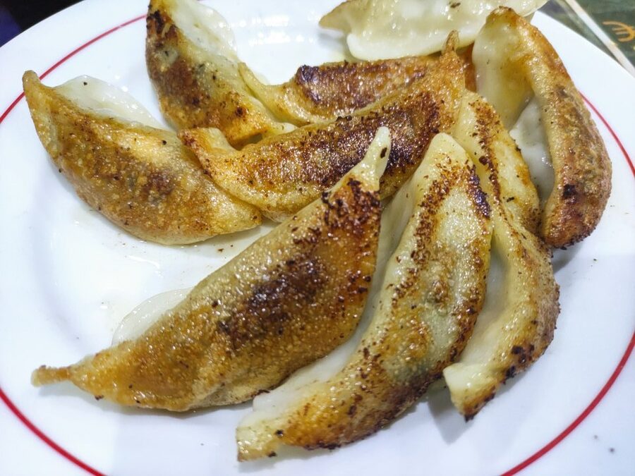 Plate of boiled jiaozi Chinese dumplings served at a northern Chinese restaurant