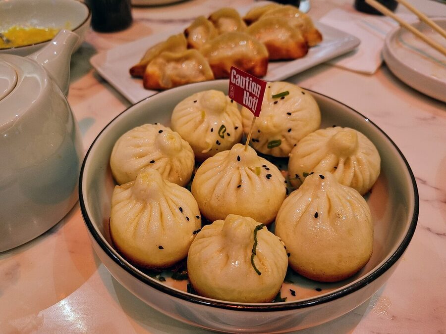Sheng jian bao Shanghai pan-fried pork buns with sesame seeds and scallions
