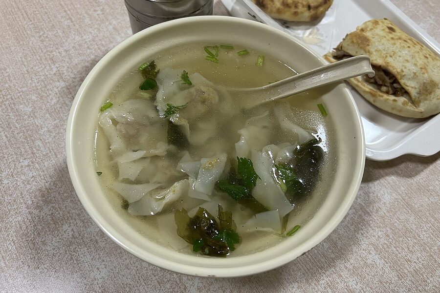 Bowl of Chinese wonton soup served at a Beijing restaurant