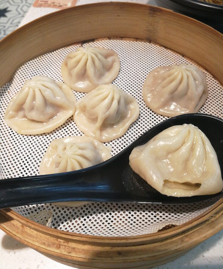 Shanghai xiaolongbao soup dumplings in a bamboo steamer