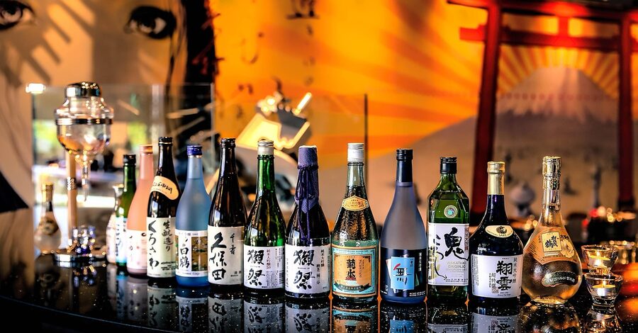 Sake bottles on shelves at a Japanese restaurant bar