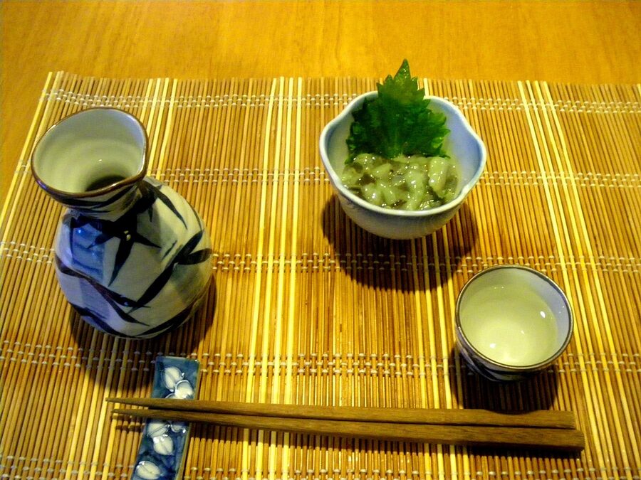Sake tokkuri flask and ochoko cup with small plate of takowasa