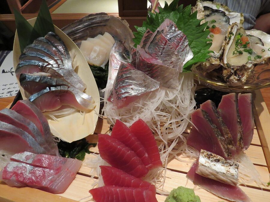 Assorted sashimi and sushi served at a Japanese counter