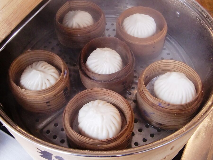 Goubuli buns steaming in bamboo steamer