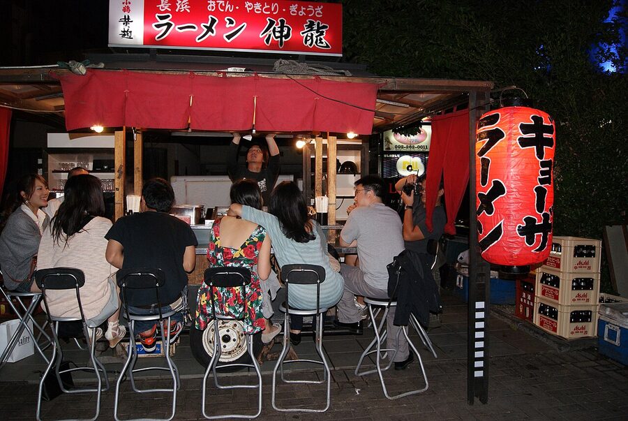 A yatai beside the Naka-gawa river in Fukuoka at evening