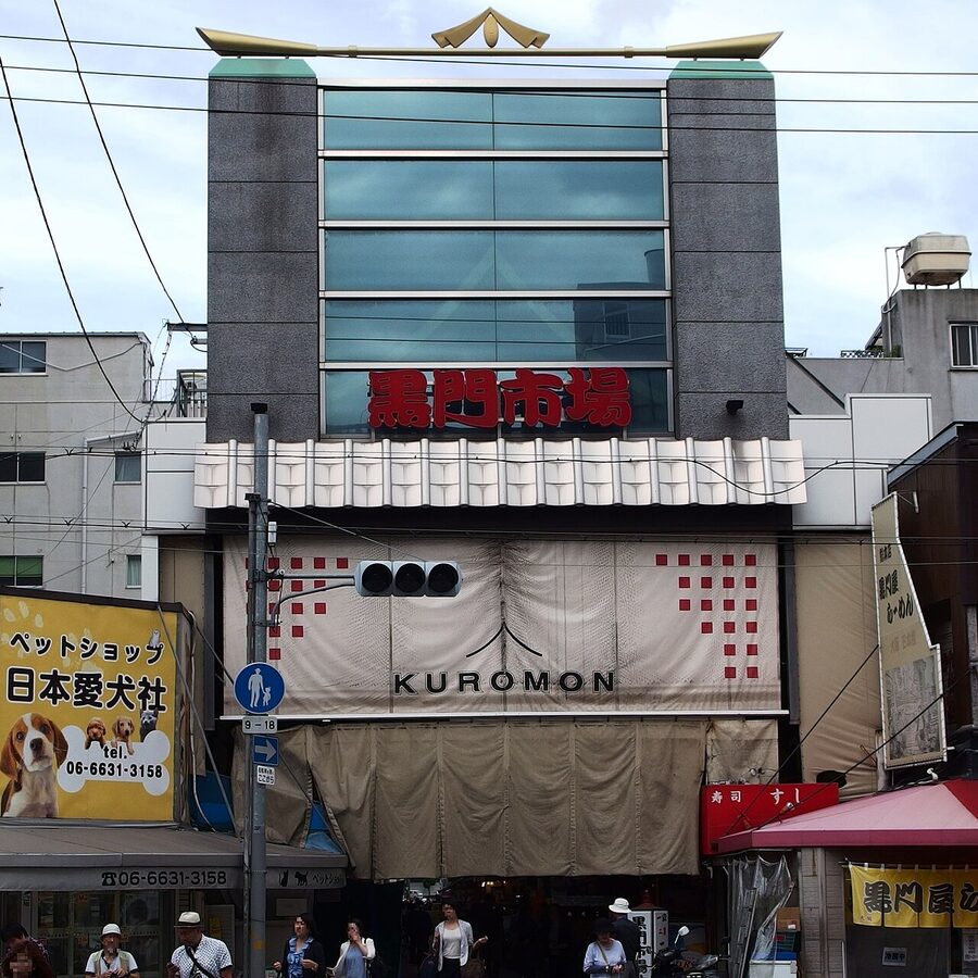 Kuromon Ichiba market in Osaka with food stalls and shoppers