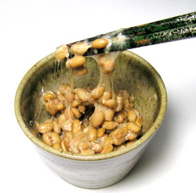 Natto fermented soybeans stirred and stringy in a bowl