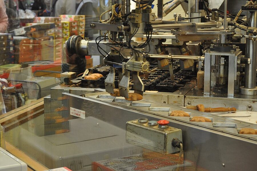 Momiji manju being made on an iron machine in Miyajima
