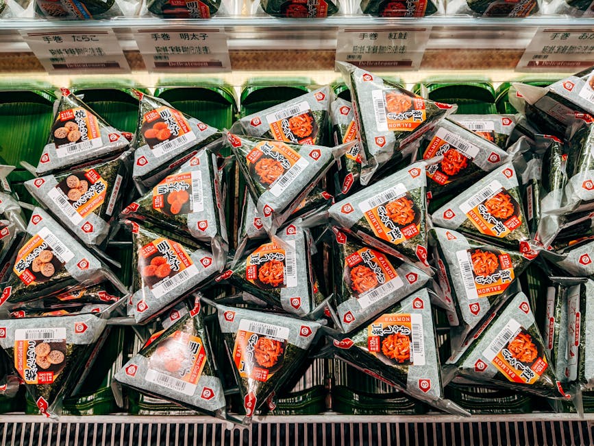 Plastic-wrapped onigiri rice balls on a konbini shelf