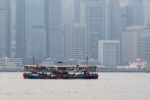 Star Ferry crossing Victoria Harbour with Hong Kong skyline