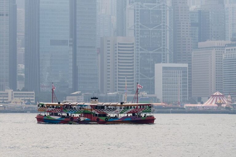 Star Ferry crossing Victoria Harbour with Hong Kong skyline