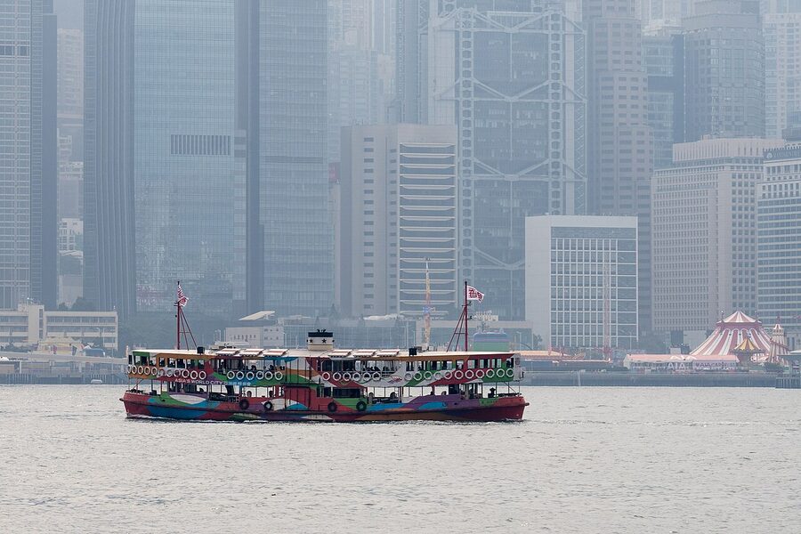 Star Ferry crossing Victoria Harbour with Hong Kong skyline