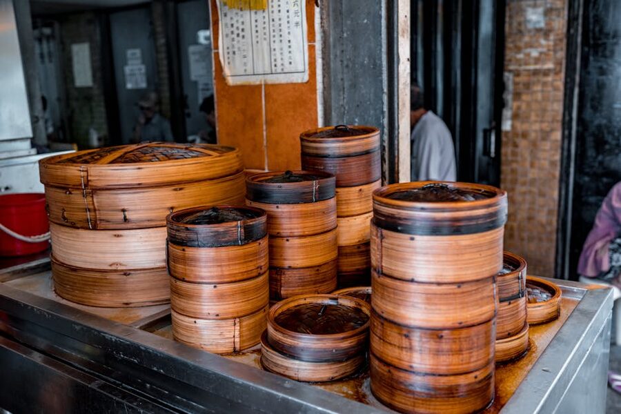 Stack of bamboo steamer baskets in a dim sum kitchen