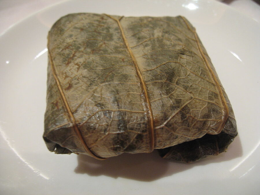 Lo mai gai glutinous sticky rice wrapped in lotus leaf