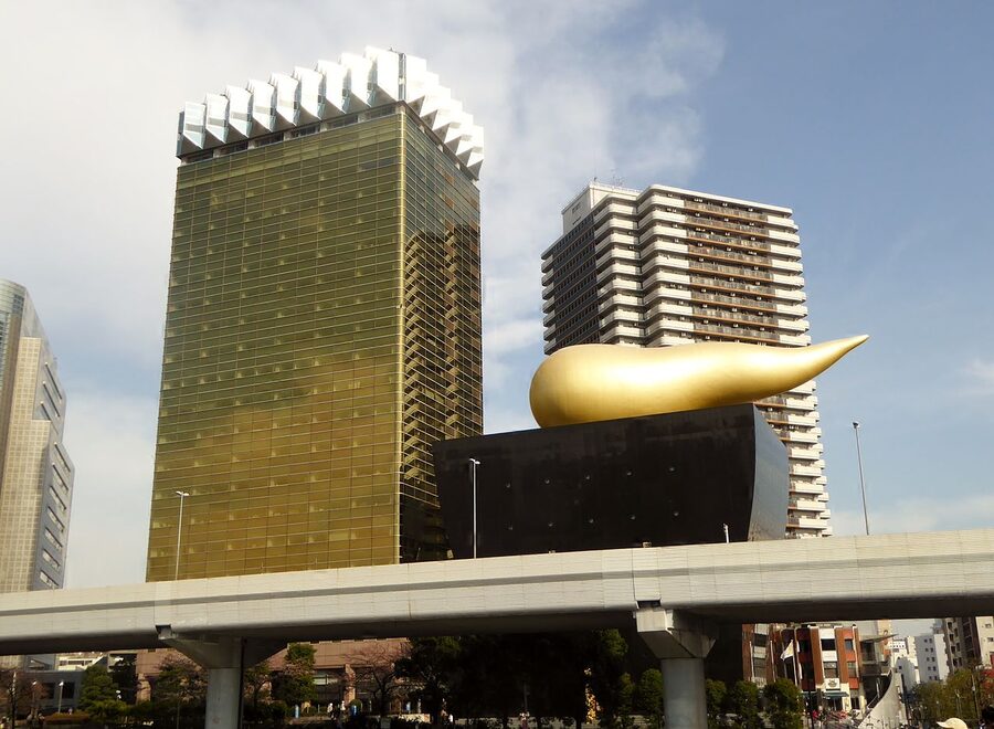 Asahi Beer Tower and Super Dry Hall in Sumida, Tokyo, with the famous golden flame sculpture on top
