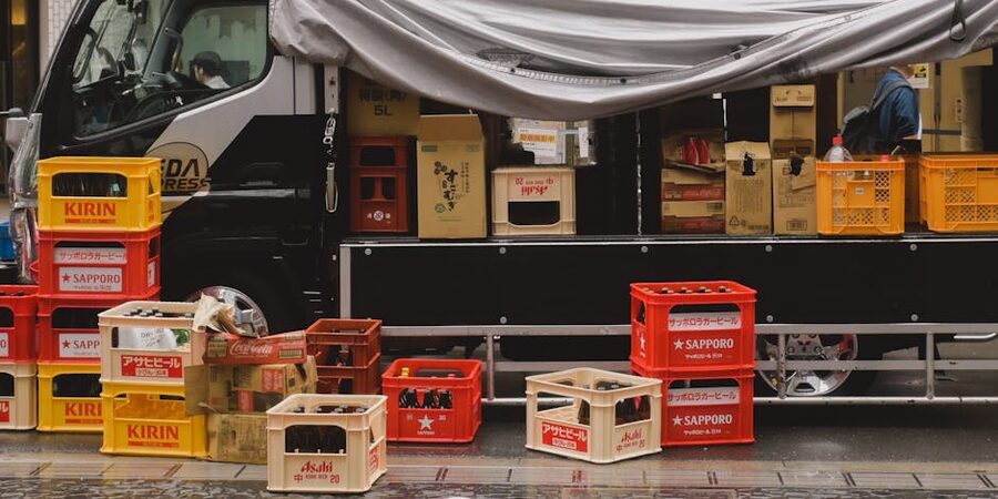 Stacked crates of Japanese beer bottles ready for distribution