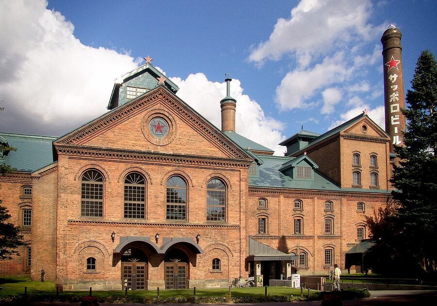 Red-brick Sapporo Beer Museum building on a clear Hokkaido day