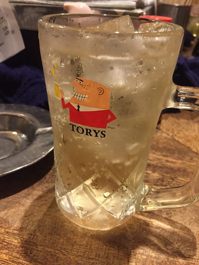Torys highball glass on an Ebisu izakaya counter, Tokyo