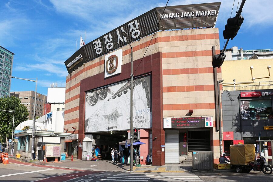Gwangjang Market food alley in central Seoul with crowds and vendors