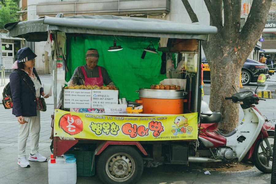 A Korean street food stand in Seoul serving traditional fish-shaped snacks