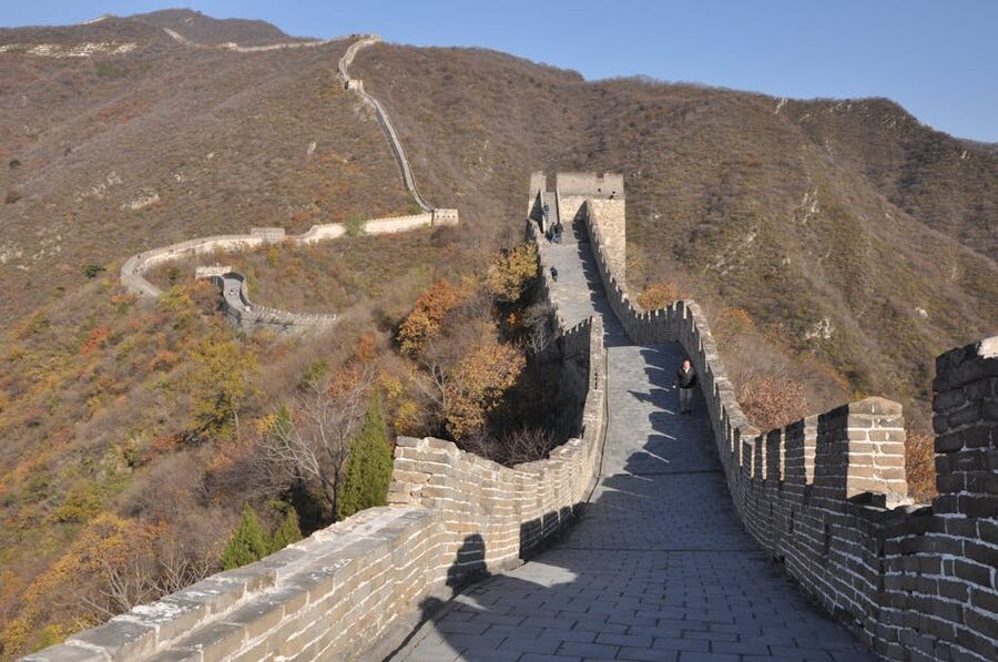 Autumn foliage and Great Wall on rolling hills
