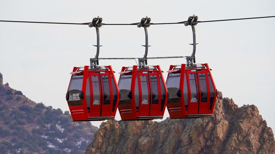 Cable car gondolas suspended in mountains