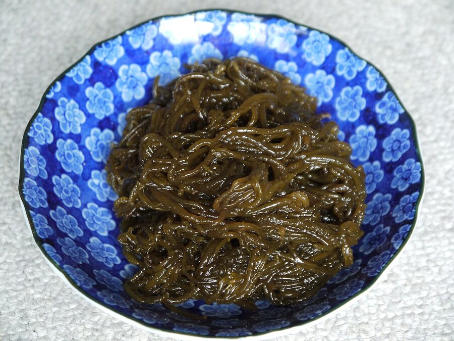 Mozuku seaweed thin slimy brown strands in a bowl