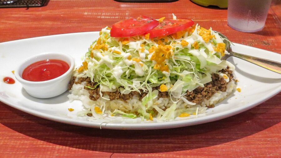 Okinawan taco rice with ground beef cheese lettuce and tomato on rice