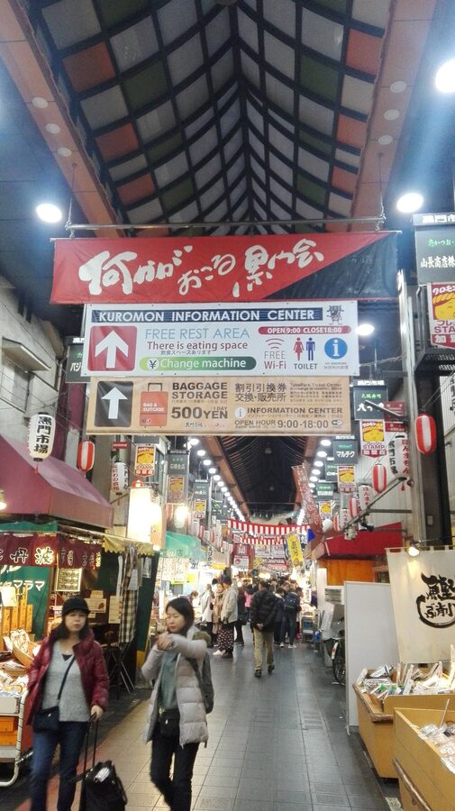 Kuromon Ichiba Market stalls and shoppers Osaka