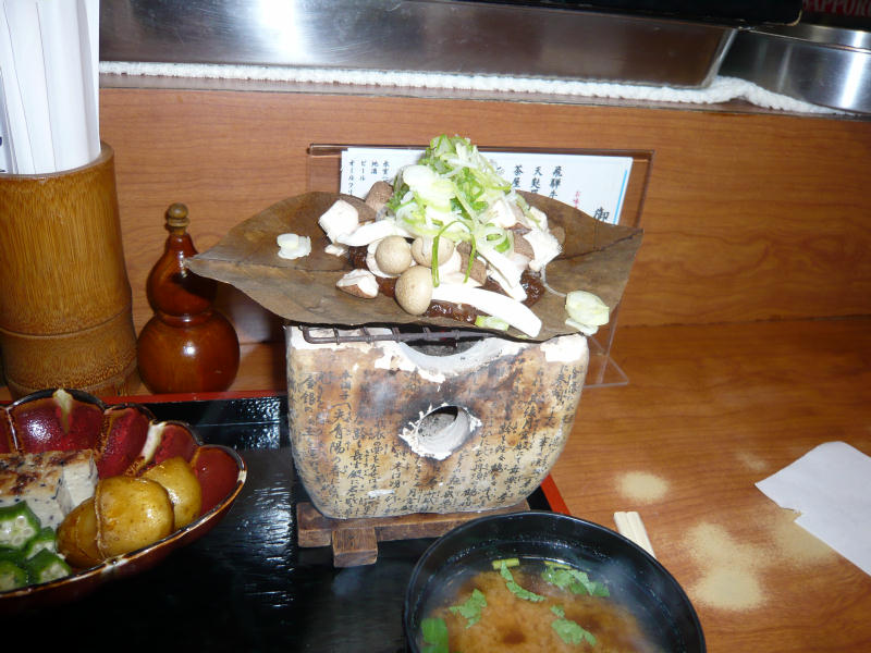 Houba miso cooking on magnolia leaf