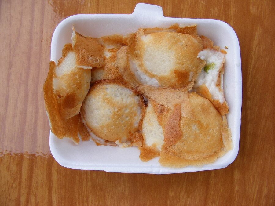 Khanom krok Thai coconut pudding cakes in foam container