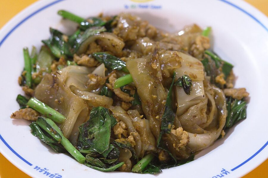 Plate of pad see ew with wide rice noodles and Chinese broccoli