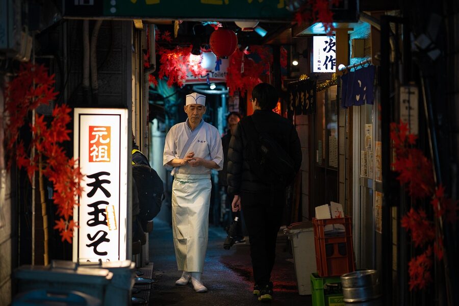 A chef cooking at a Shinjuku Memory Lane yakitori stall