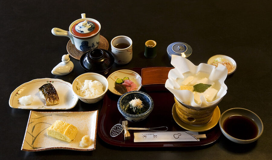 Traditional kaiseki breakfast tray with multiple small dishes