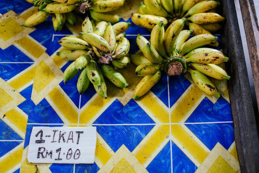 Banana bunches at a Southeast Asian fruit stand