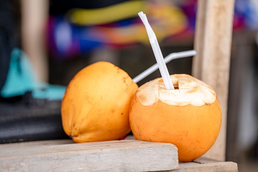 Fresh young coconuts with drinking straws