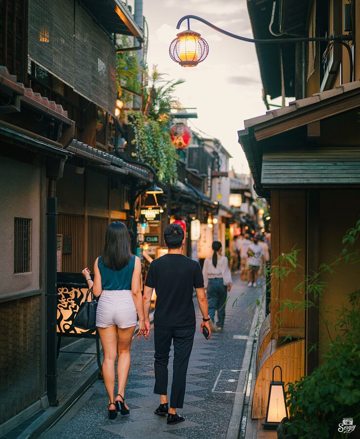 Narrow Pontocho Alley lined with lanterns in central Kyoto at dusk