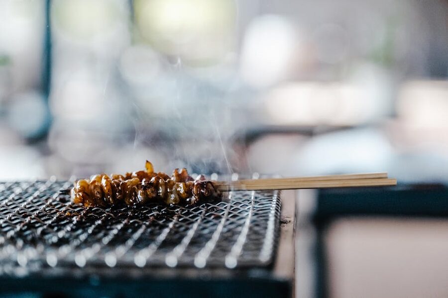 Smoke rising over a yakitori konro grill in Japan