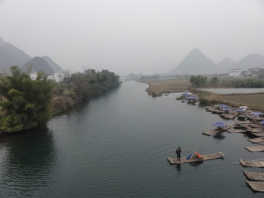 Yulong River bamboo rafts with boatmen poling
